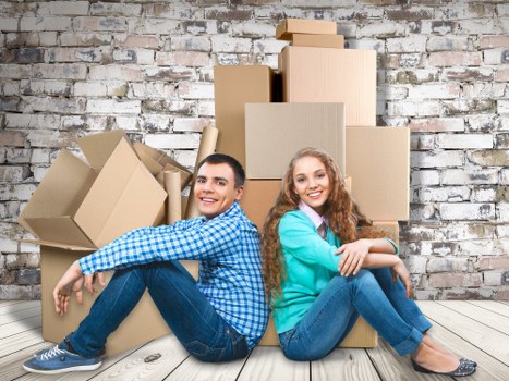 Experienced Brookgreen house movers unloading items at a new home