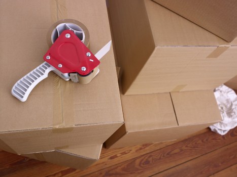Packed moving boxes and furniture ready for transport in Brookgreen